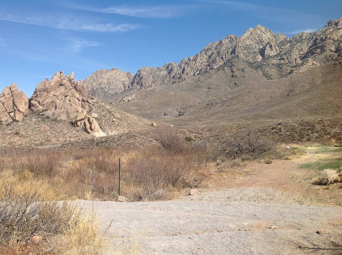 A trail with a view of the Organ Mountains at Dripping Springs Natural Area