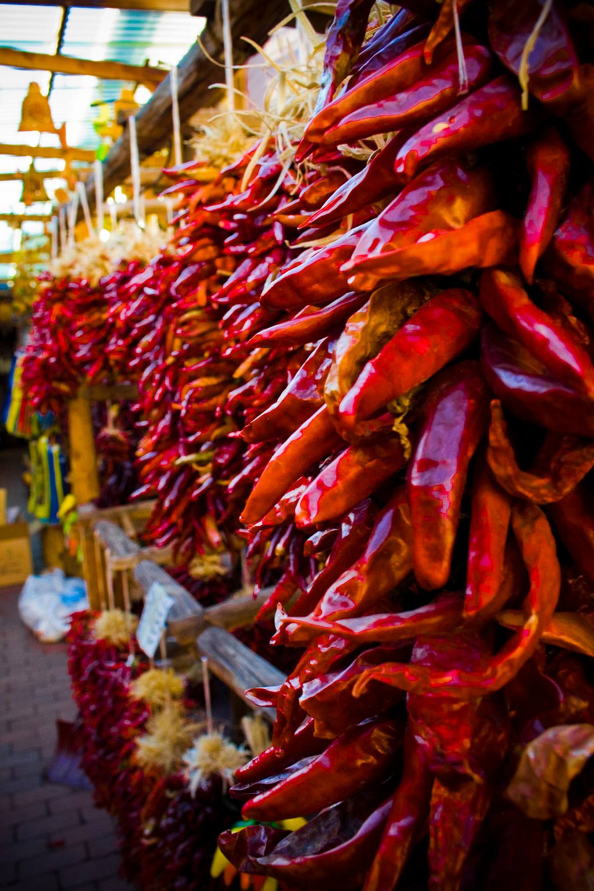 Strings of red chile peppers hanging at a New Mexico market