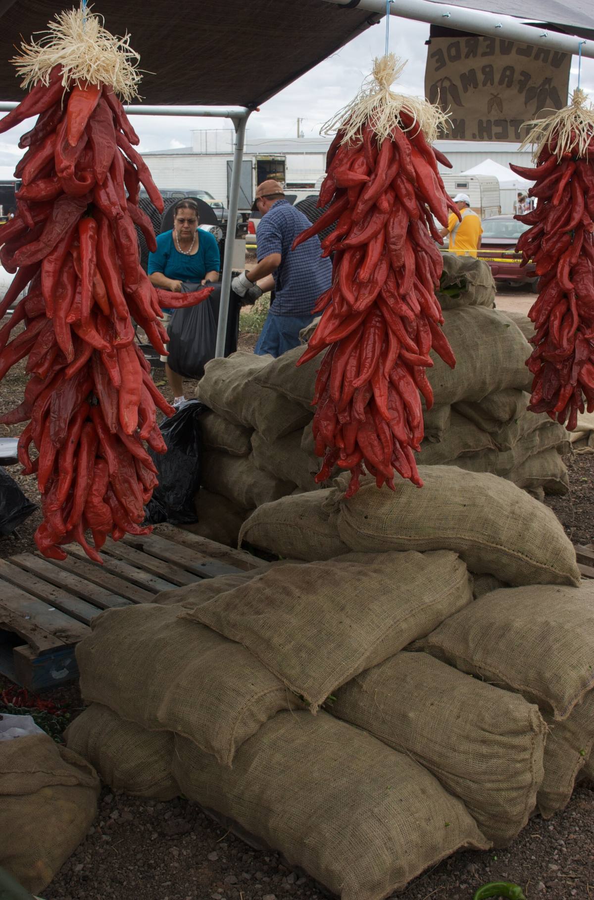Chile ristras and sacks of produce at a stand in Hatch, New Mexico